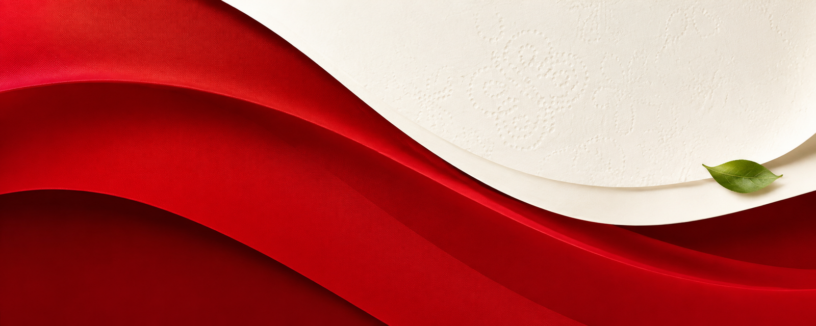 Soft white tissue beside a flowing Ariella-red ribbon