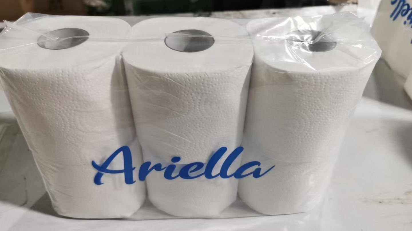 Close-up of real Ariella branded toilet tissue rolls
